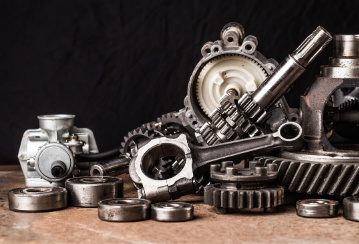 Photo of car parts on a table.