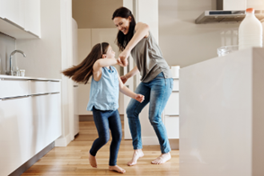 Woman dancing with daughter